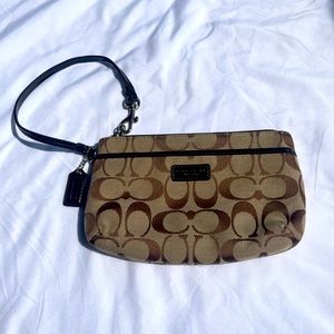 Brown authentic Coach wristlet. Signature C design.